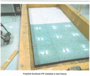 PolySoft pour-in-place surface tiles installed in a timber laboratory fixture for ASTM F1951 wheelchair accessibility testing
