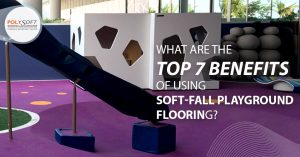Modern playground with purple seamless soft-fall surfacing, orange dot inlays, white cubby house, black slide and climbing boulders